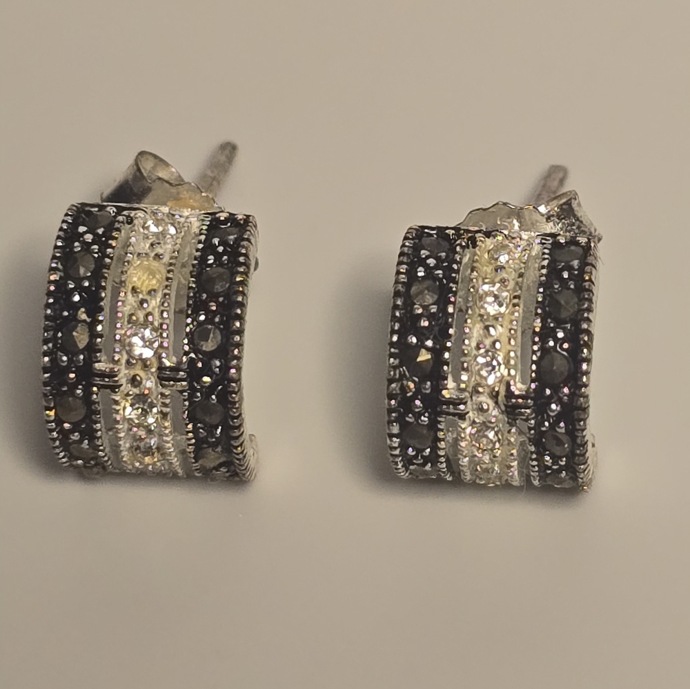 sterling silver J-hoop earrings featuring marcasite and pavé stones. 